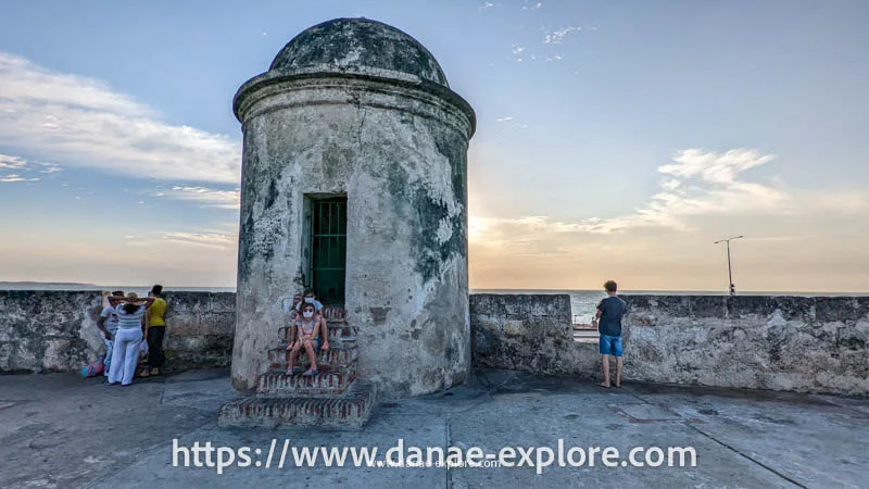 People watching the sunset on the walls of the old city of Cartagena