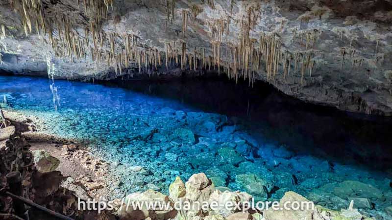 Panoramic view of the Lago Azul Cave, in Bonito. where you can see the cave with several stalectites and the lake with waters in different shades of turquoise blue, and transparent to the point where you can clearly see the stones in the background