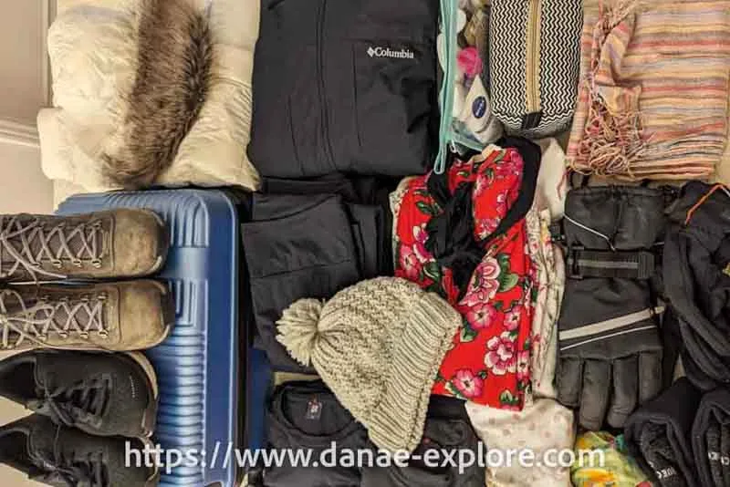 separate clothes for a winter holiday trip, practical tips on how to travel with just carry-on luggage