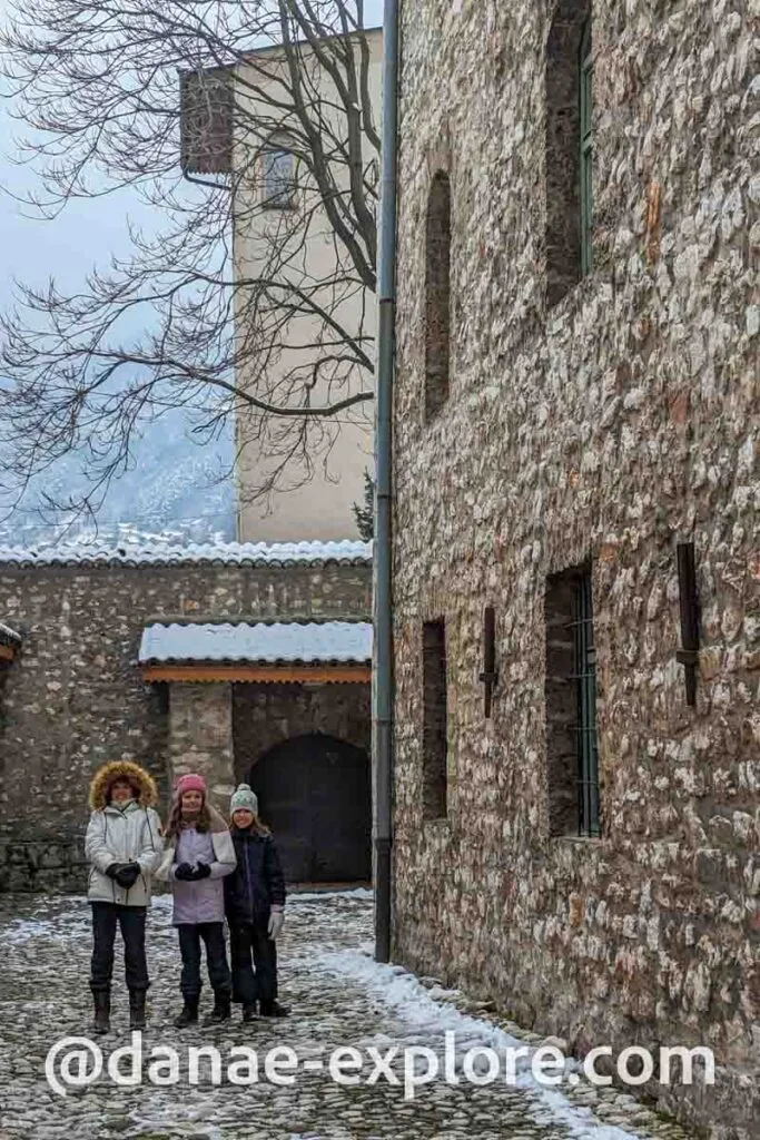 three children in winter clothes play outside the Jewish Museum of Sarajevo, one of the suggestions of what to do in Sarajevo in 1 or 2 days
