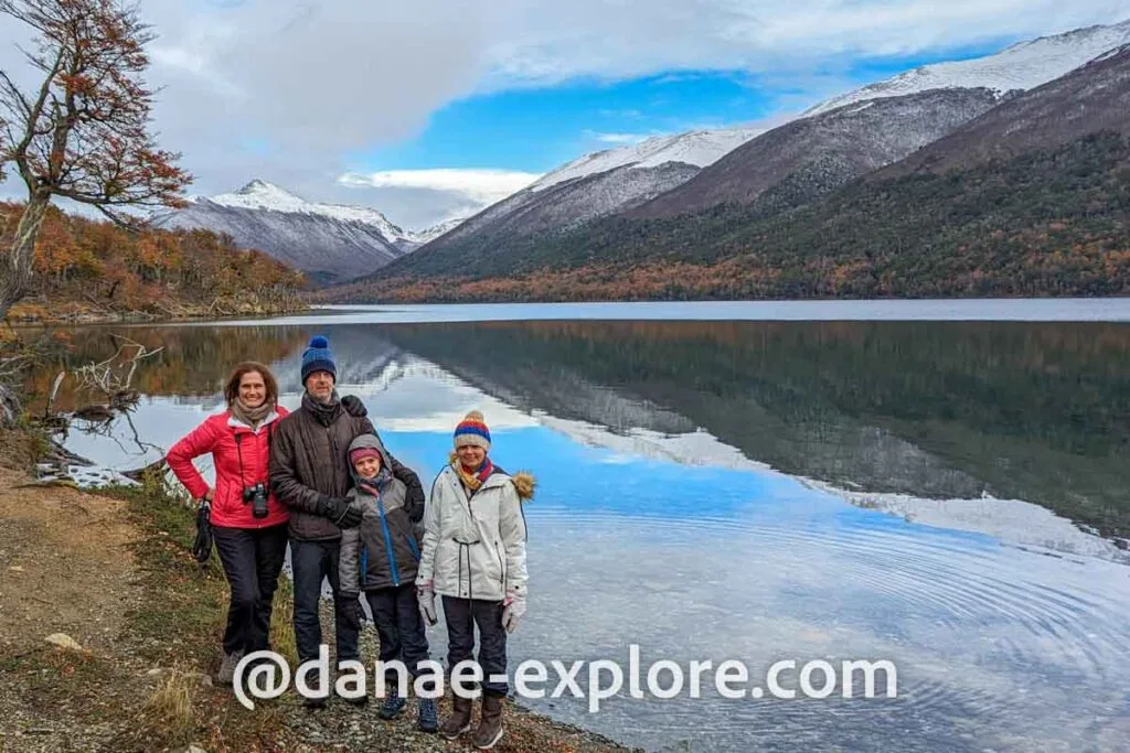Family - father, mother and two girls, on a cold day, at Lago Escondido, in Ushuaia, Tierra del Fuego, Argentina