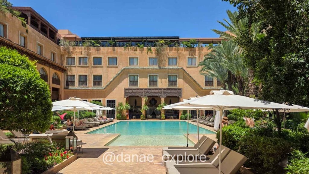 view of the inner courtyard, with pool and sun loungers, at the Les Jardins de la Katoubia hotel, where we stayed in Marrakesh