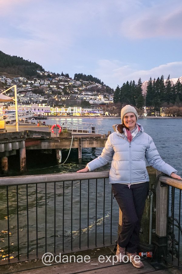 Me in Queenstown, by Lake Wakatipu, on a winter late afternoon. The town lights are already on, but the sky is still bright